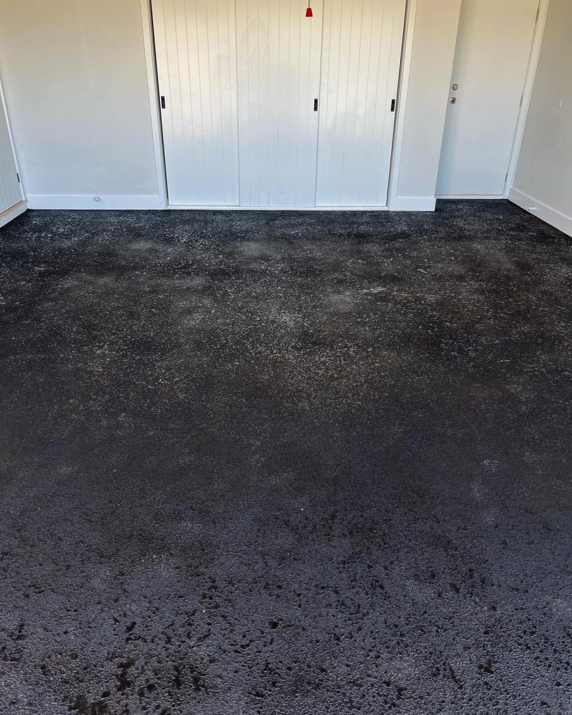 Garage floor concrete resurfacing with cut stone finish