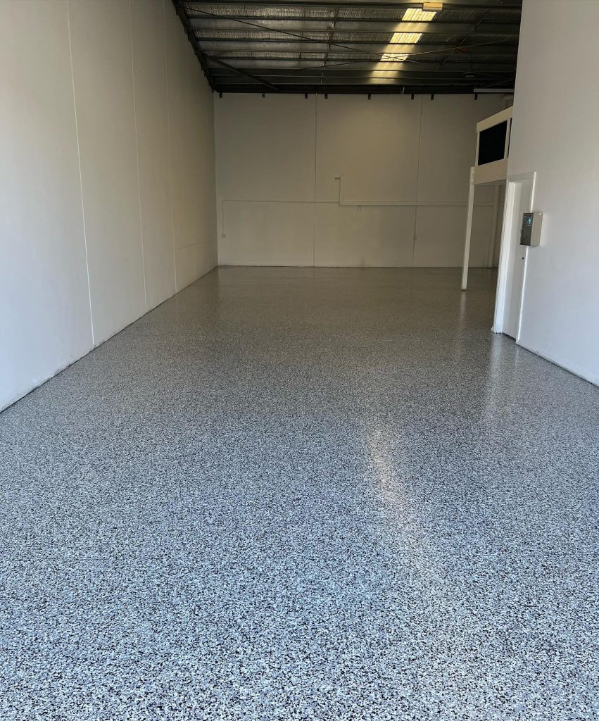 Factory flake epoxy flooring in Melbourne commercial workspace