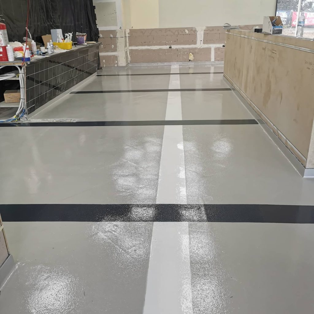 Commercial epoxy flooring in fast food kitchen preparation area