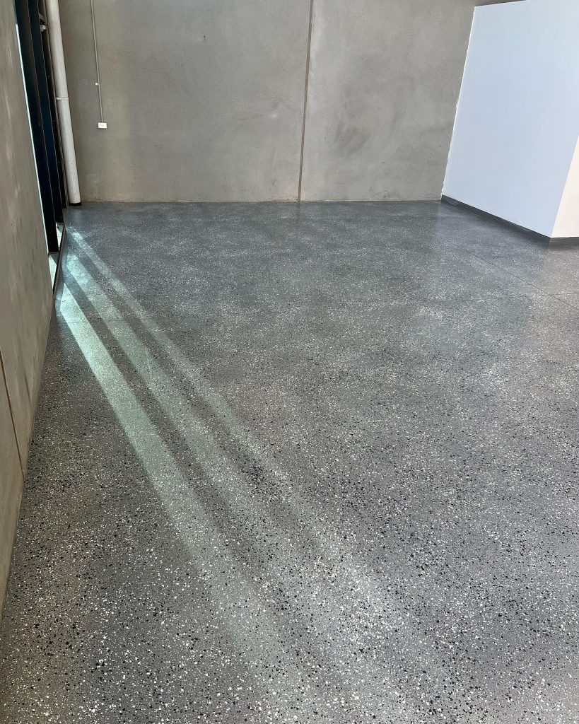 Water based epoxy flooring with exposed aggregate look in factory