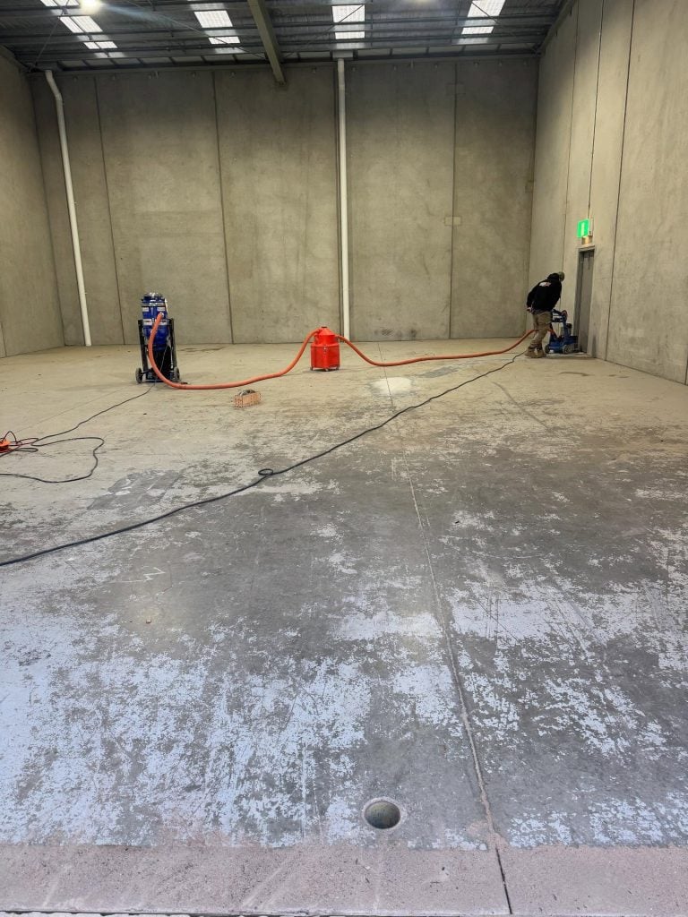 Factory floor before epoxy flooring installation in Melbourne