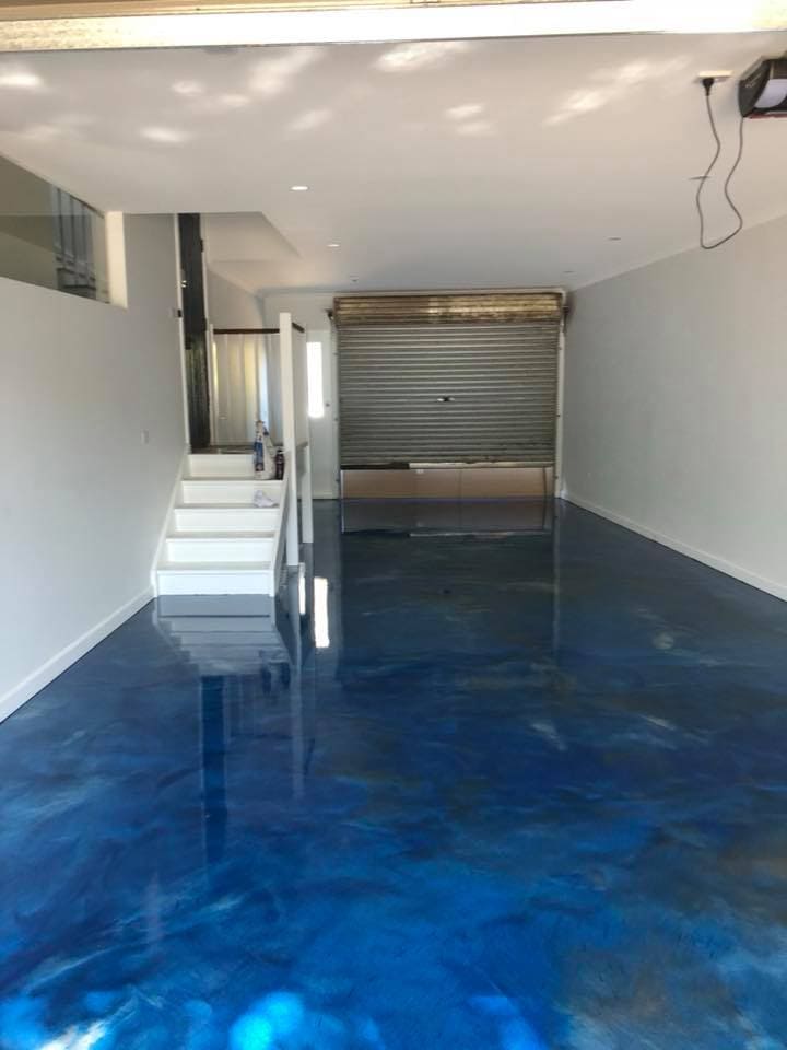 Blue metallic epoxy garage flooring installation in Melbourne