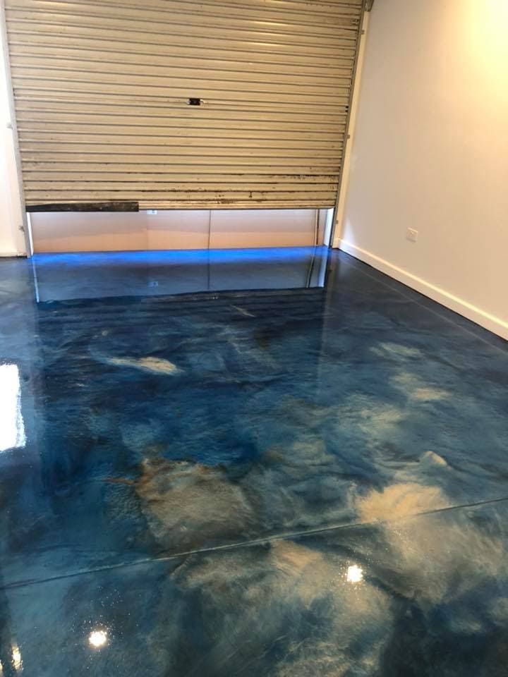 Blue metallic garage epoxy flooring with black rock effect in Melbourne