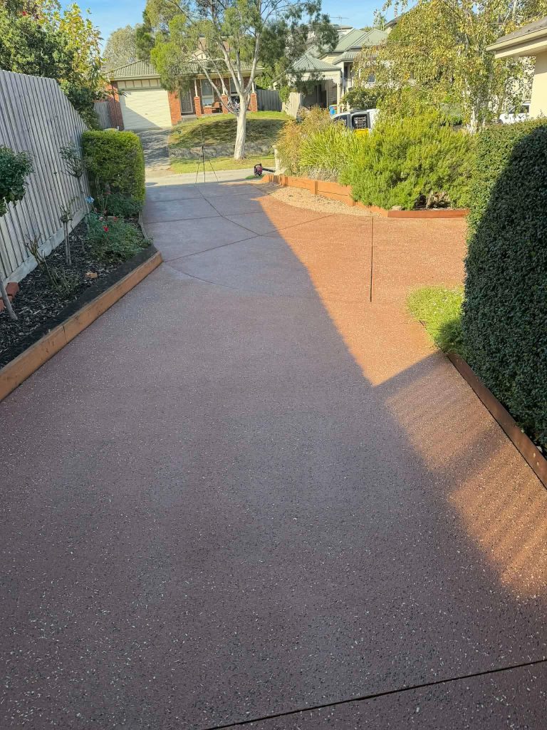 Concrete driveway after pressure cleaning and resealing in Berwick Melbourne