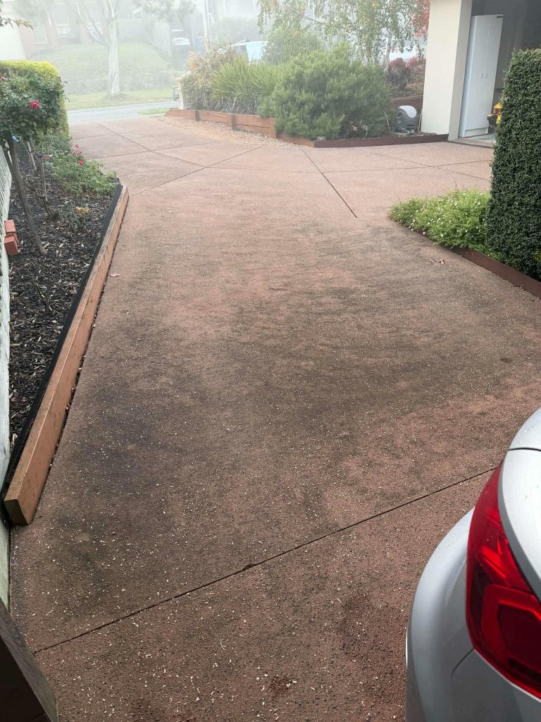 Concrete driveway before pressure cleaning and resealing in Berwick Melbourne