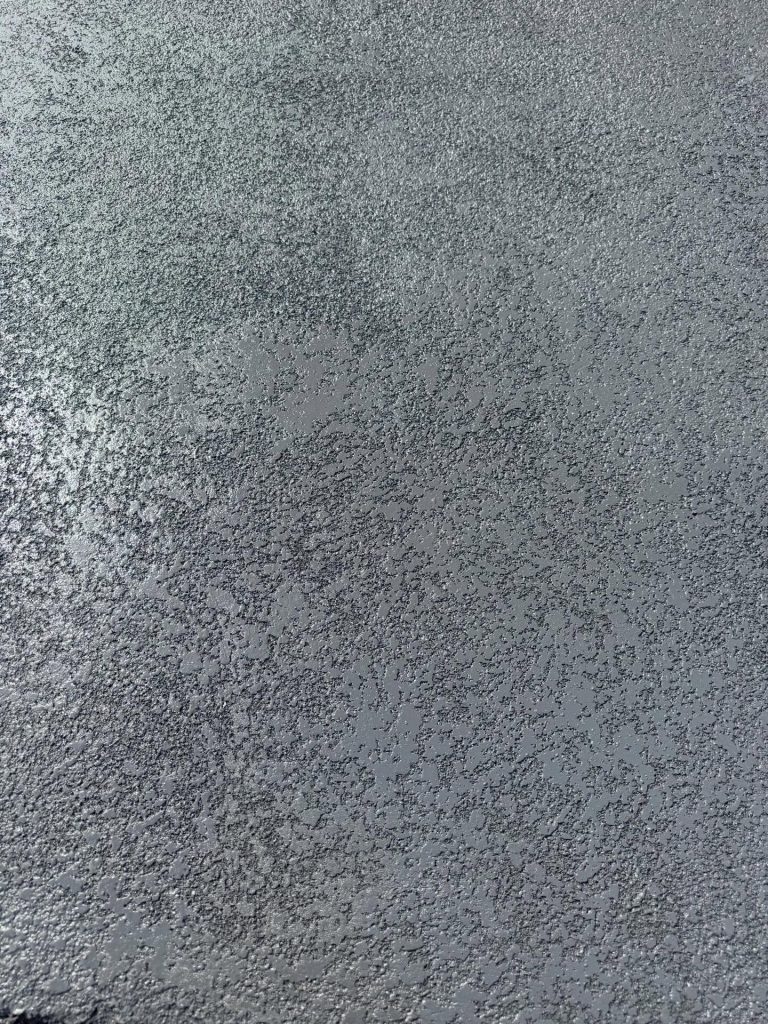 Close up of cut stone concrete resurfacing finish used on steep Mount Eliza driveway for added texture and slip resistance