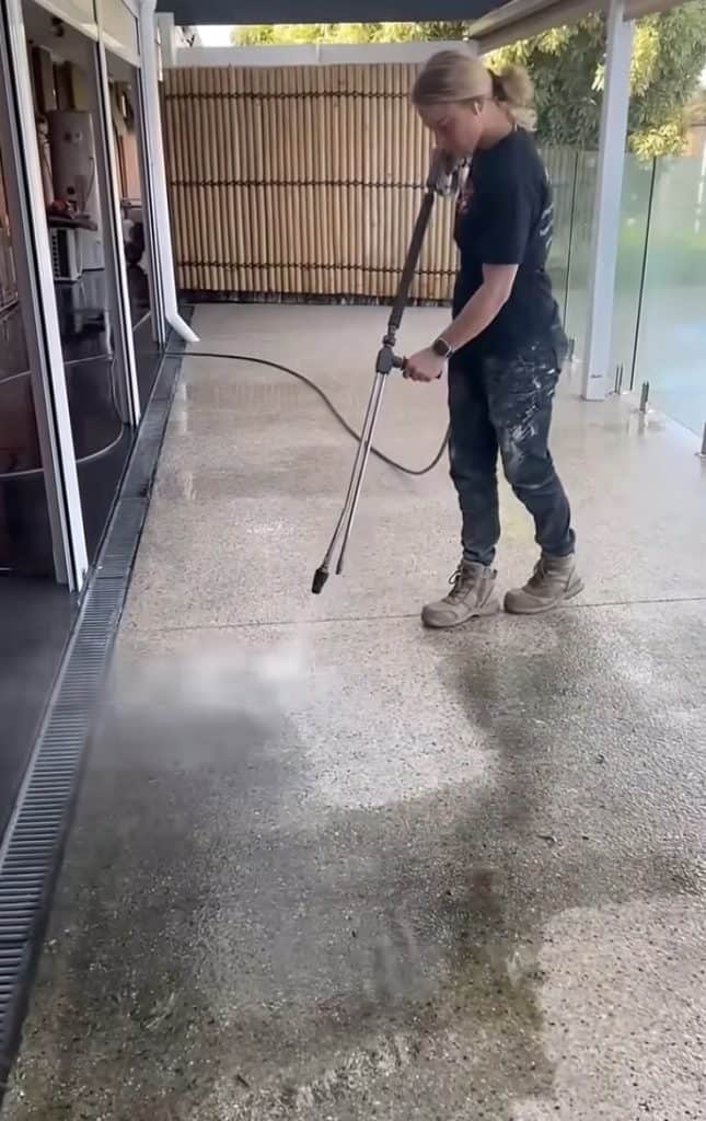 Pressure cleaning exposed aggregate concrete before sealing