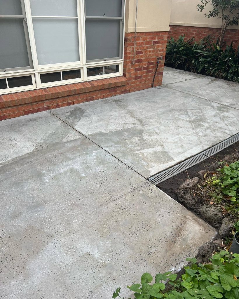 Worn outdoor entertainment area concrete in Box Hill before decorative spray-on resurfacing