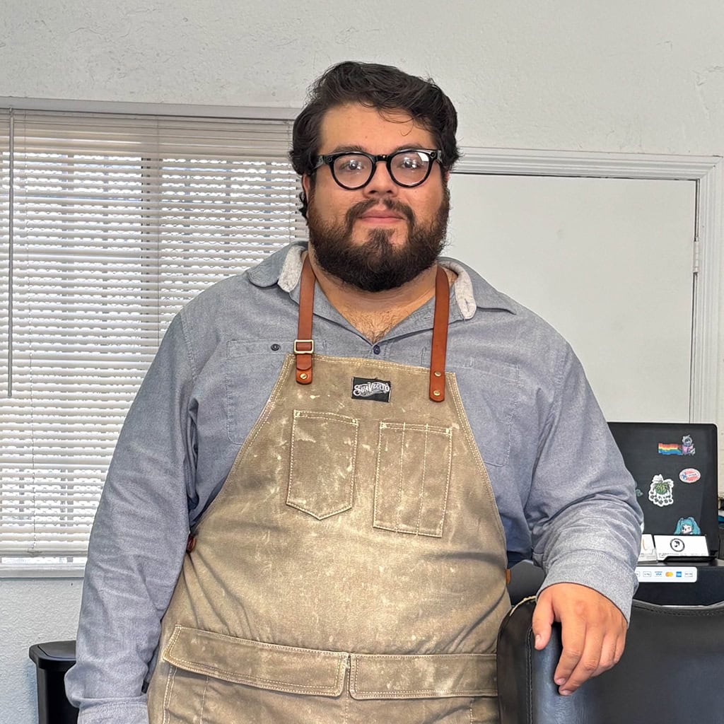 The Owner of the Barbershop standing next to a barbershop near Gardena CA 90247