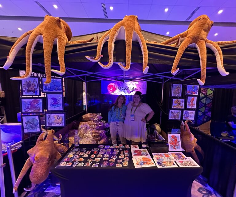 Chelsea and Vee at Reef-a-palooza orlando in octonation octopus booth