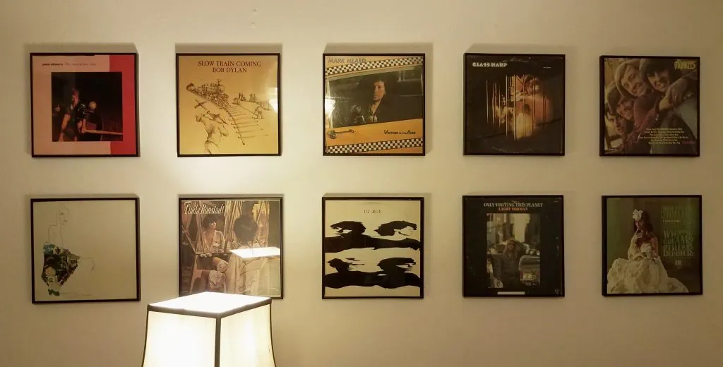 Photograph of a wall with ten framed albums.