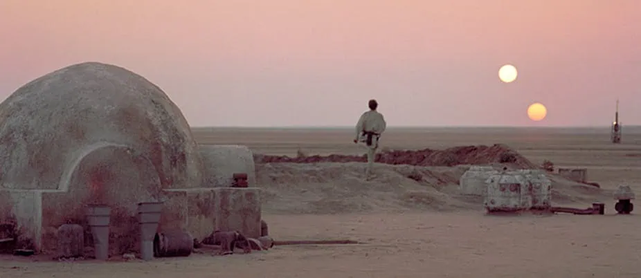 Luke gazing out at the binary suns on Tatooine.