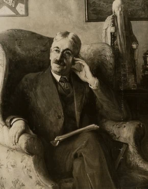 Portrait of John Dewey sitting in a chair