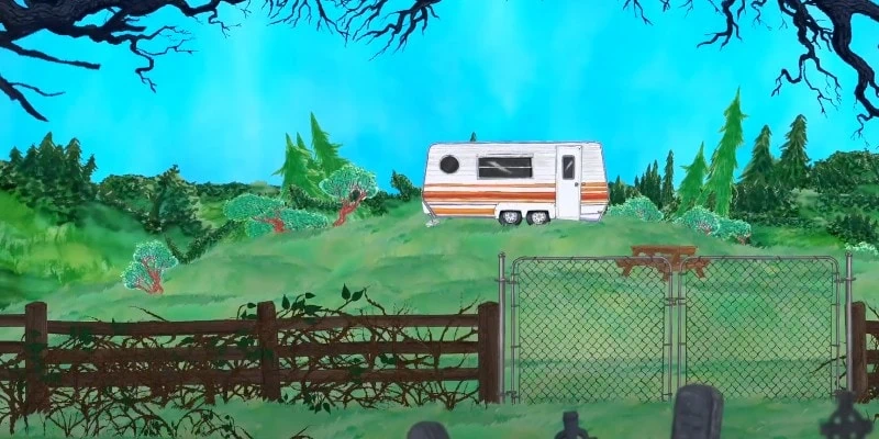 Trailer on a hill over a graveyard