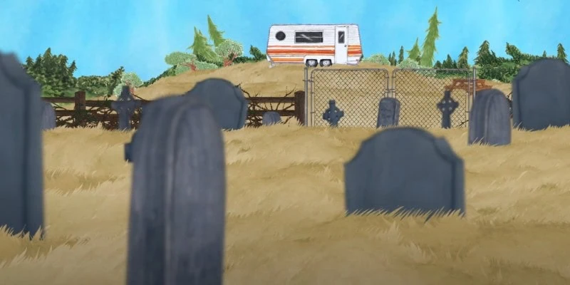 Trailer on hillside overlooking cemetery in brown grass