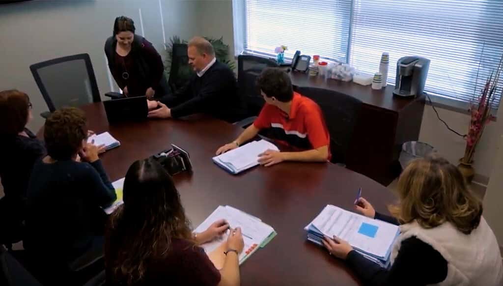 Meeting in the Columbus title offic.