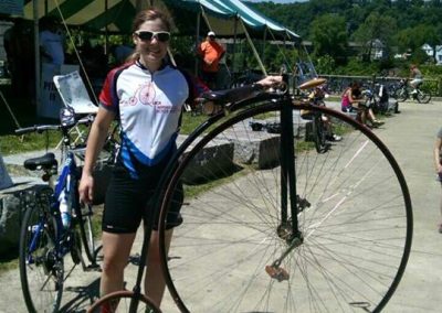 Penny farthing bike at outdoor event.