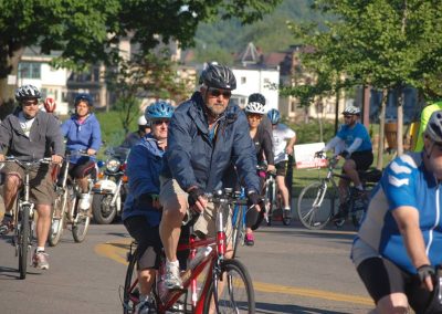 Group of cyclists riding on a scenic trail in Ohio Valley.