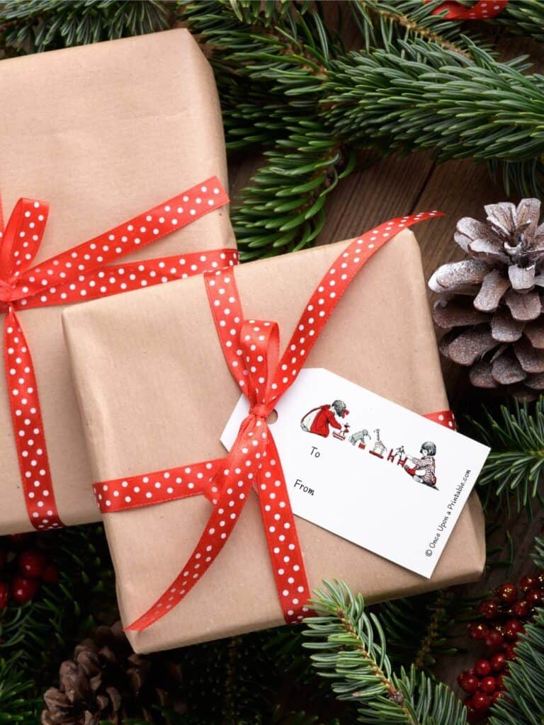 Simple vintage Christmas gift tags on brown paper wrapped boxes and red ribbon, adorned with a vintage illustration by Jessie Willcox Smith's version of Twas the night before Christmas story.