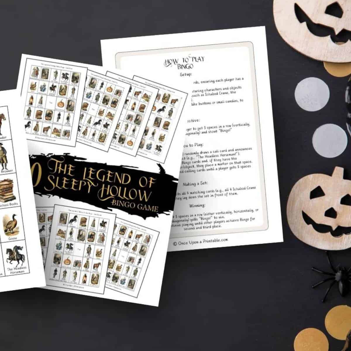 The Legend of Sleepy Hollow Bingo game printables on a black table with jack-o-lanterns and black pumpkins.