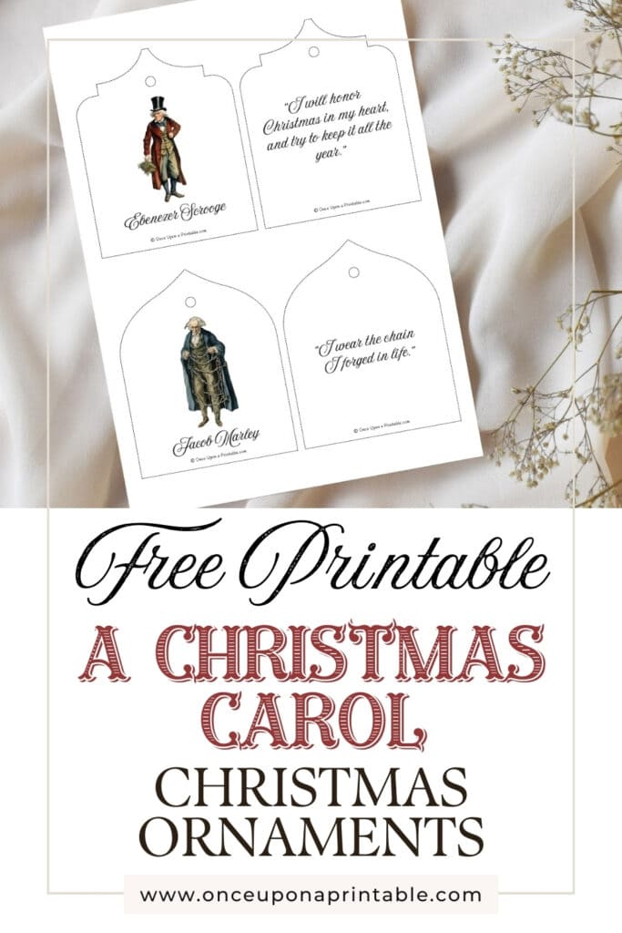 Scrooge and Marley printable christmas tree oranments page laying on a white table cloth with baby's breath.