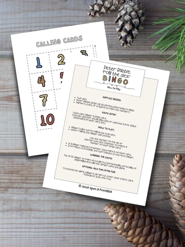 how to play the peter rabbit roll the dice bingo game with colorful call out cards laying on a wooden floor with pinecones.