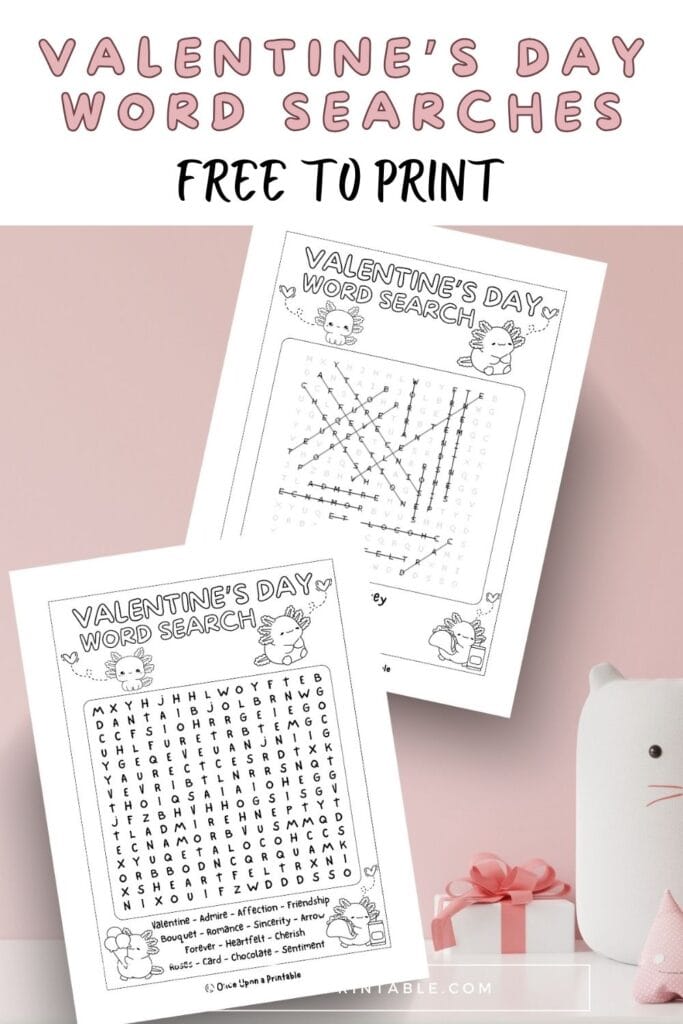 Axolotl Valentine's Day crossword puzzle and answer key laying on a pink background.