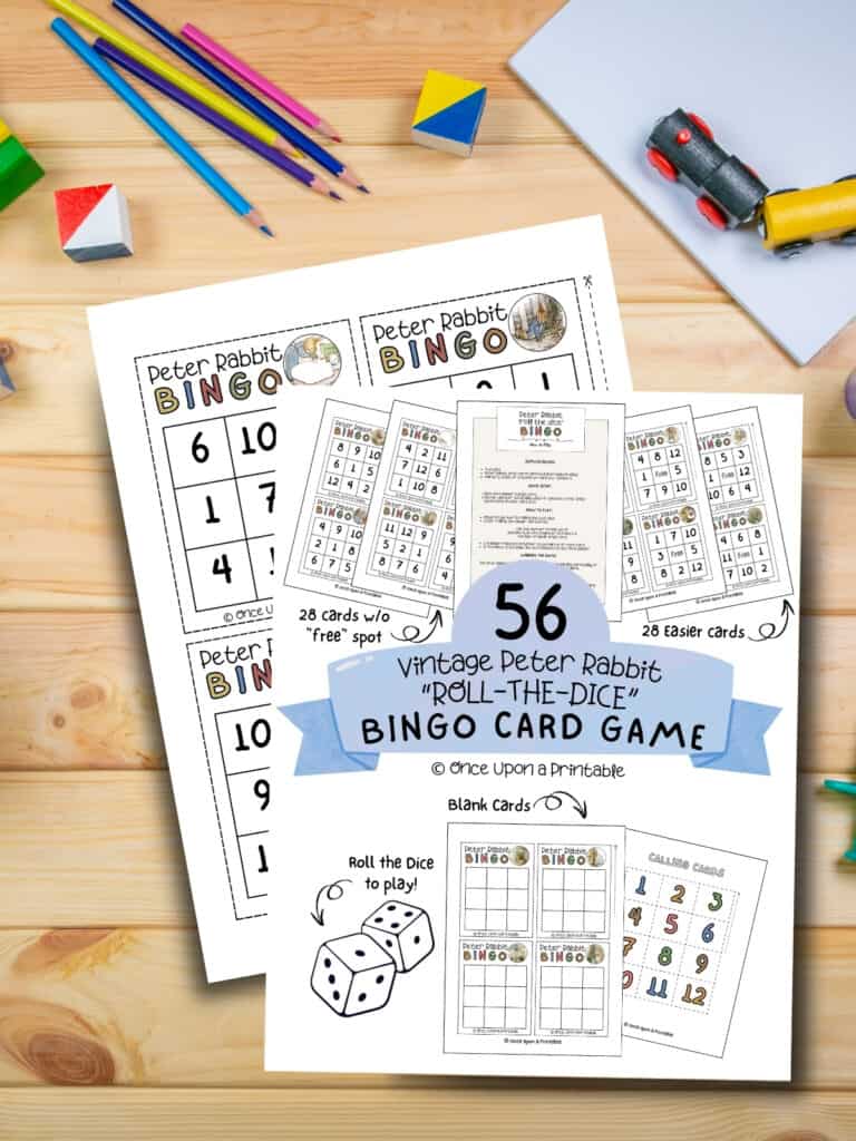 Peter Rabbit illustrated bingo cards laying on a wooden table with coloring pencils and crayons.