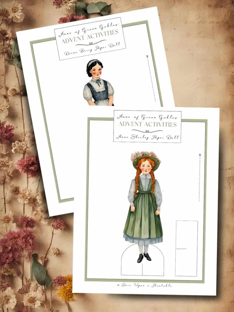 Anne of Green Gables paper dolls laying on a brown paper background with dried flowers.