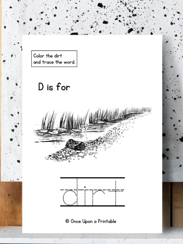 D is for Dirt word tracing and a coloring page worksheet laying on a speckled background.