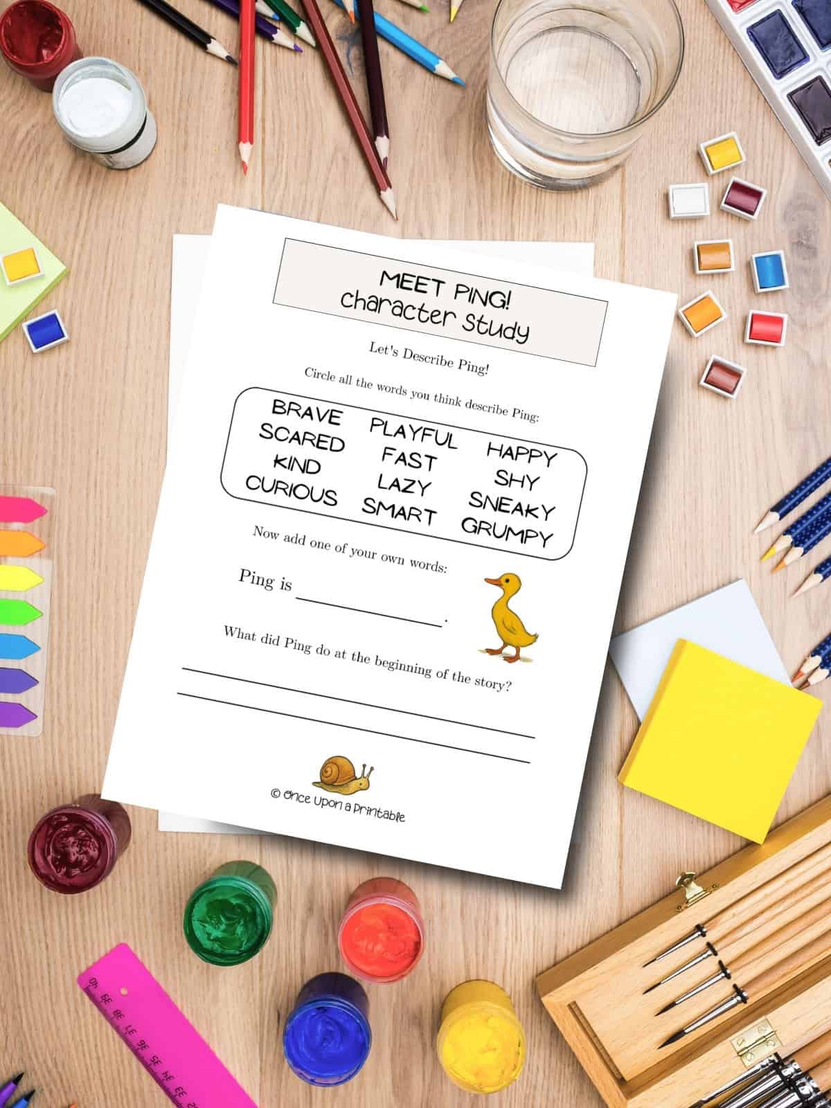 Meet Ping character study worksheets laying on a table with coloring supplies.