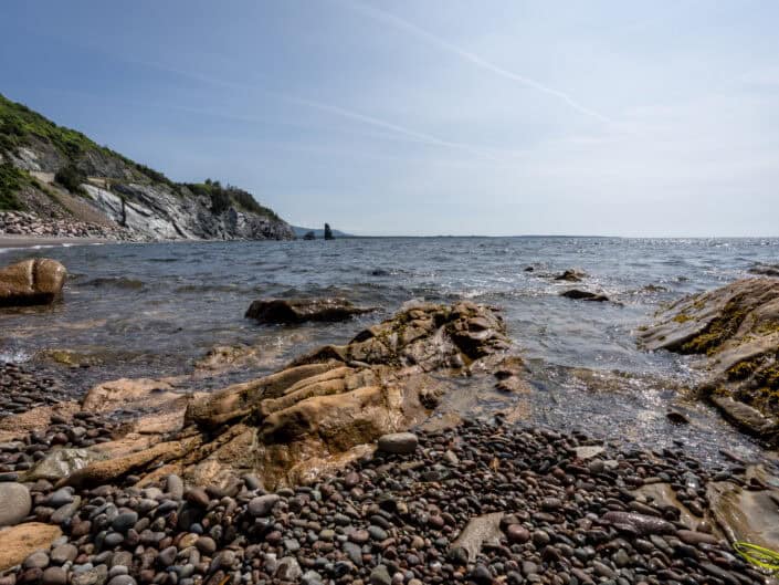 Rocks and water on the shore of a beach. Weekend Getaway on Cape Breton Island
