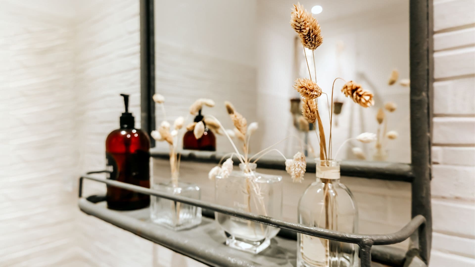 Decorations in a mirror shelf for a bathroom. 
