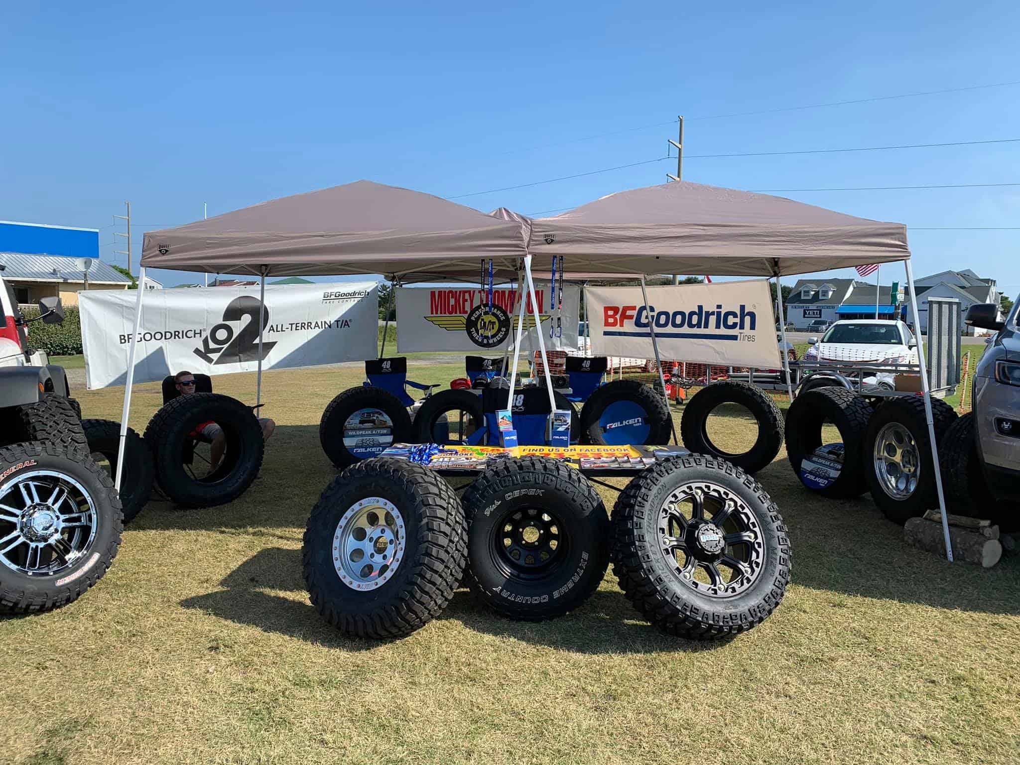 All Car & Truck Repair tire display at outdoor event.