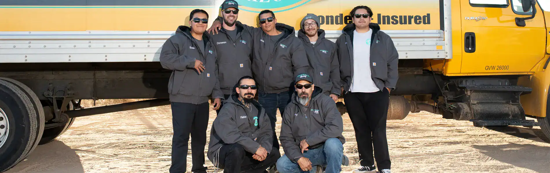 Overall Moving crew in front of a truck
