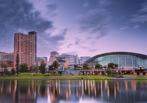 Cityscape of Adelaide featuring modern buildings and a waterfront view, reflecting the vibrant urban environment where Ozora Electrical Services operates.