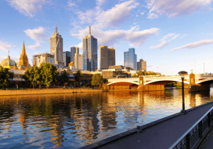 Melbourne city skyline with Yarra River, showcasing modern buildings and bridges, relevant to Ozora Electrical Services' presence in Melbourne.