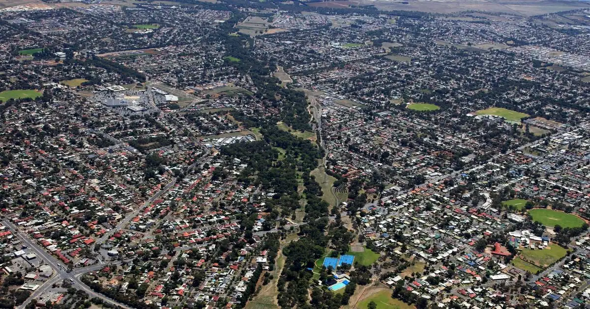 Aerial view of Salisbury showcasing residential areas, commercial buildings, and green spaces in South Australia, highlighting the community's layout and infrastructure.