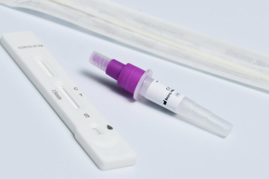 Lateral Flow rapid test kit with swab sample for quick virus detection.