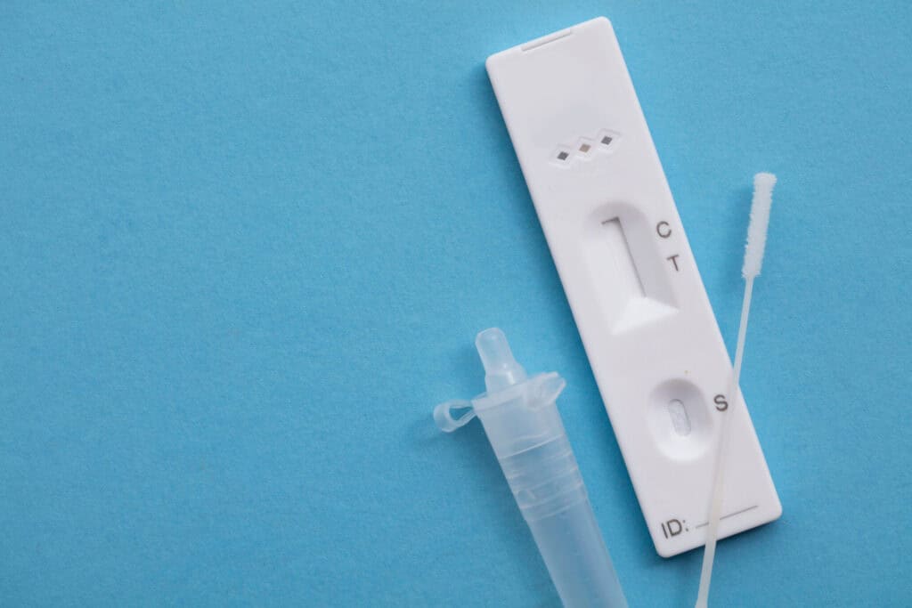 Lateral Flow rapid test kit with swab and sample collection device for quick detection.