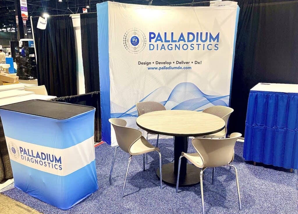 Palladium Diagnostics booth at ADLM 2024 conference showcasing diagnostic solutions.