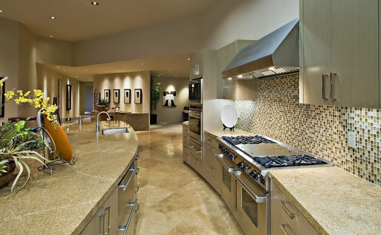 Elegant Gourmet Kitchen With Granite Countertops, Mosaic Tile Backsplash, And Premium Appliances Featured In Custom Luxury Homes In Palmilla.