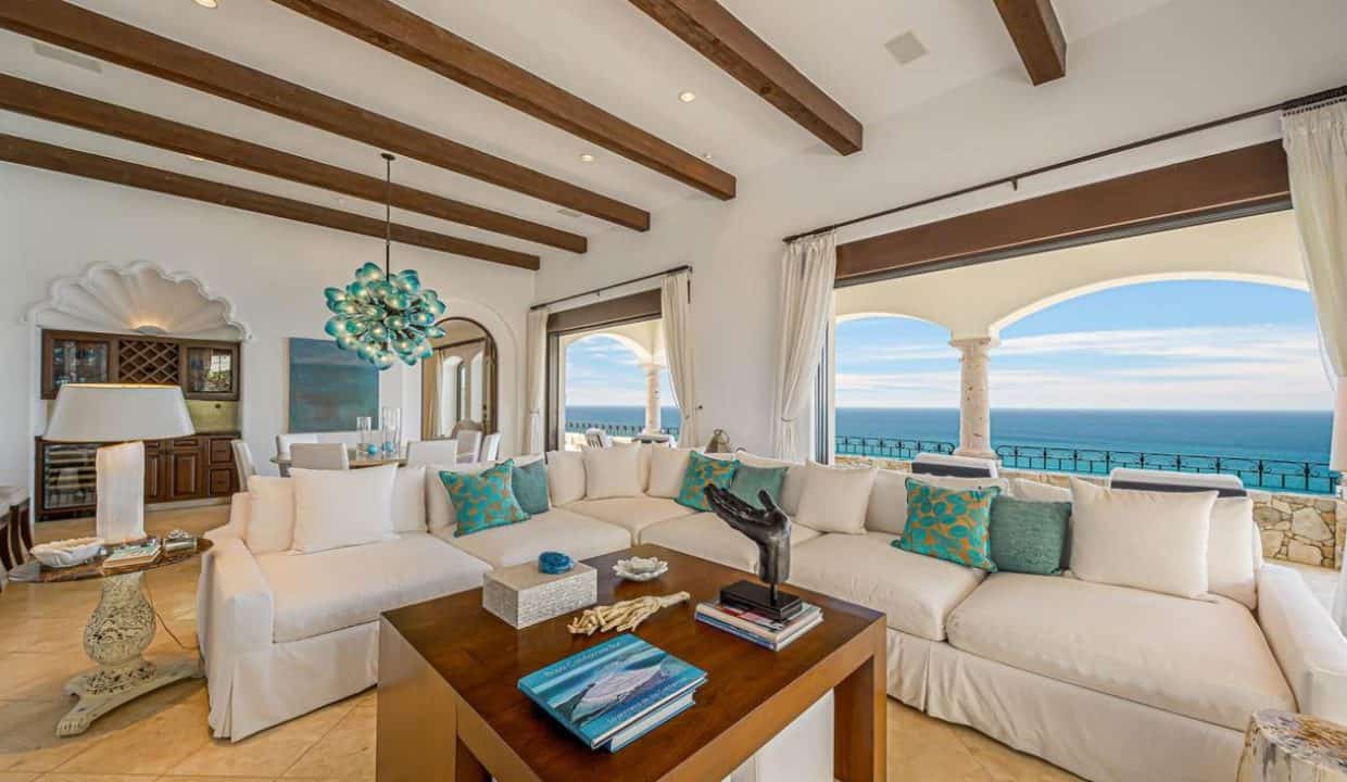 Elegant Living Room With Ocean Views At Villas Del Mar, Showcasing Exclusive Houses In Palmilla For Sale With Luxury Design And Cabo’s Premier Lifestyle.