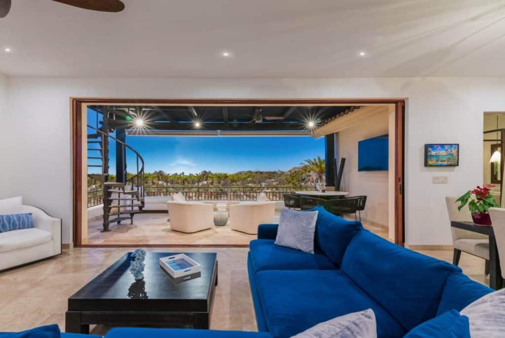Spacious Modern Living Room With Terrace And Panoramic Views At Palmilla Dunes, Showcasing Exclusive Houses In Palmilla For Sale With Luxury Design.