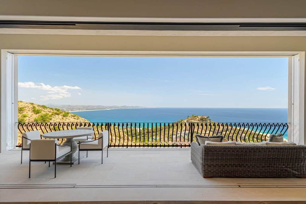 Expansive Terrace At La Montaña 7 In Villas Del Mar, Palmilla, Featuring Outdoor Seating And Panoramic Views Of The Sea Of Cortez And San José Bay In Los Cabos.