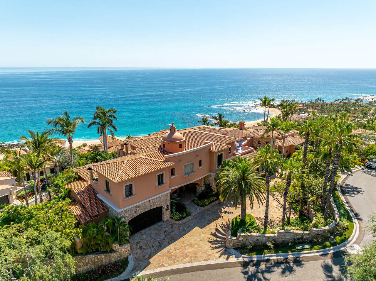 Luxurious Palmilla Oceanfront Estate With Vibrant Landscaping, Terracotta Roof, And Stunning Sea Views In A Premier Coastal Community. Perfect For Luxury Living And Investment.