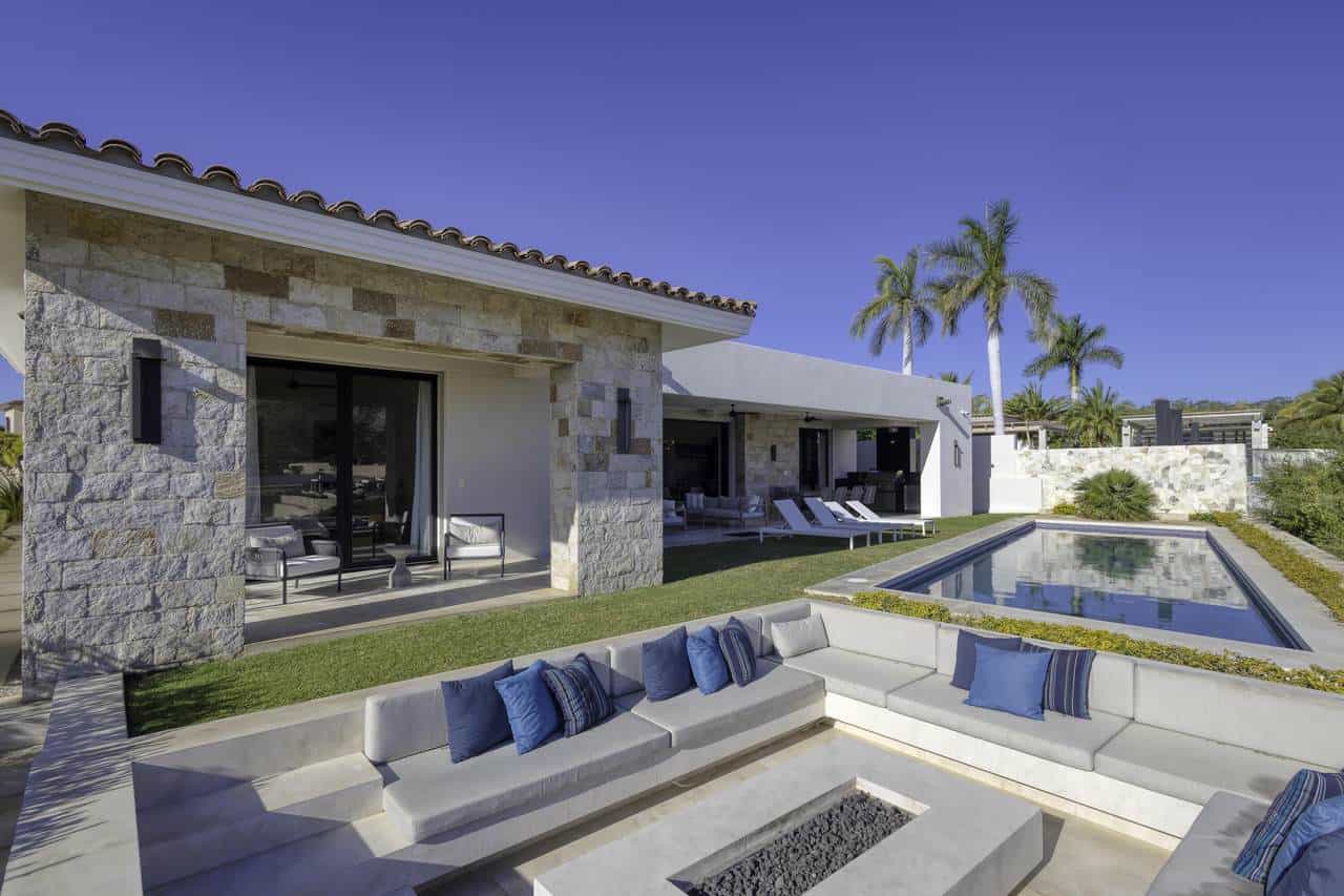 Luxurious Palmilla Beachfront Estate With Modern Design, Private Pool, Outdoor Lounge, And Tropical Landscaping, Perfect For Upscale Living And Relaxing In Paradise.