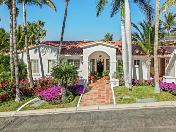 Palmilla Estate With Lush Tropical Landscaping And Vibrant Flowers.