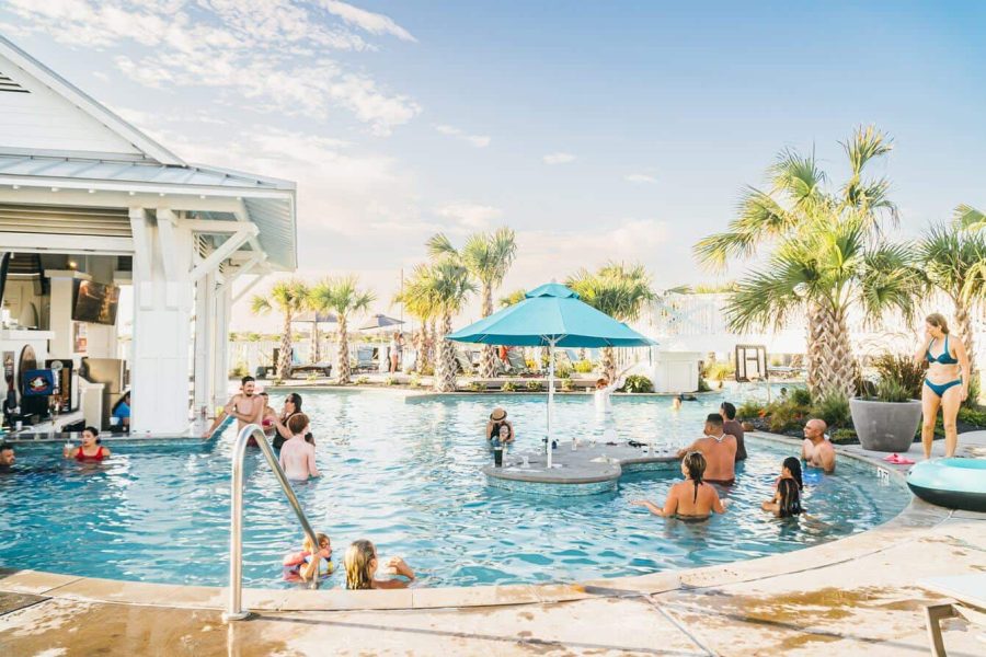 Fitness And Wellness – Homes For Sale In Palmilla Luxurious Palmilla Resort Pool With People Enjoying Sunny Weather, Palm Trees, And Relaxing Atmosphere. Perfect For Vacation Or Celebration At Palmilla Real Estate Properties.