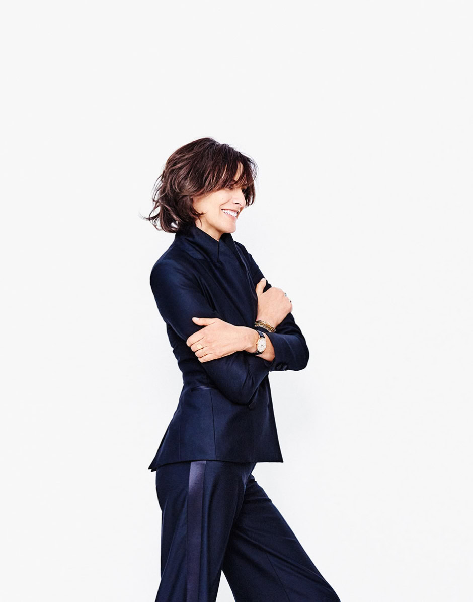 Elegant female fashion portrait in navy blue suit, professional studio photography, modern business attire, confident woman model, fashion photography by Pamela Hanson.